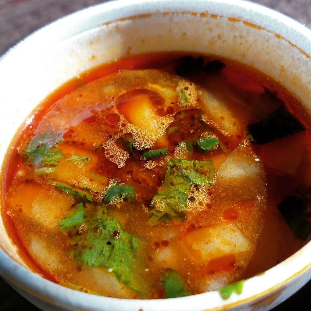House consommé — rich chili broth with herbs